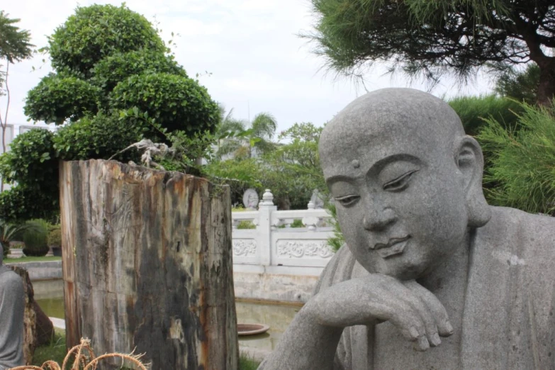 a buddha statue is looking over its shoulder