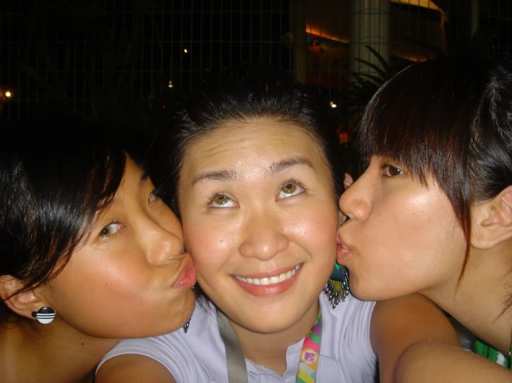 a group of four girls are together on their arms