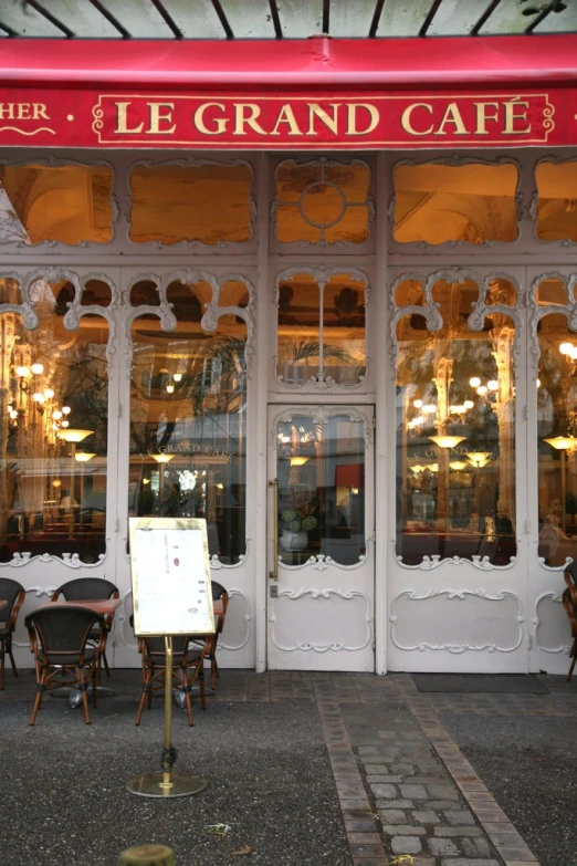 the front of a french restaurant with a menu