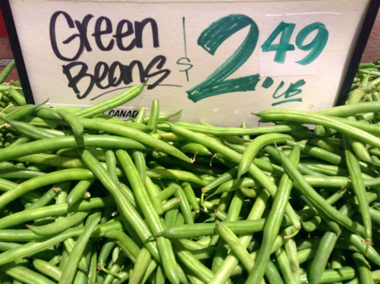 many green beans are displayed in a supermarket