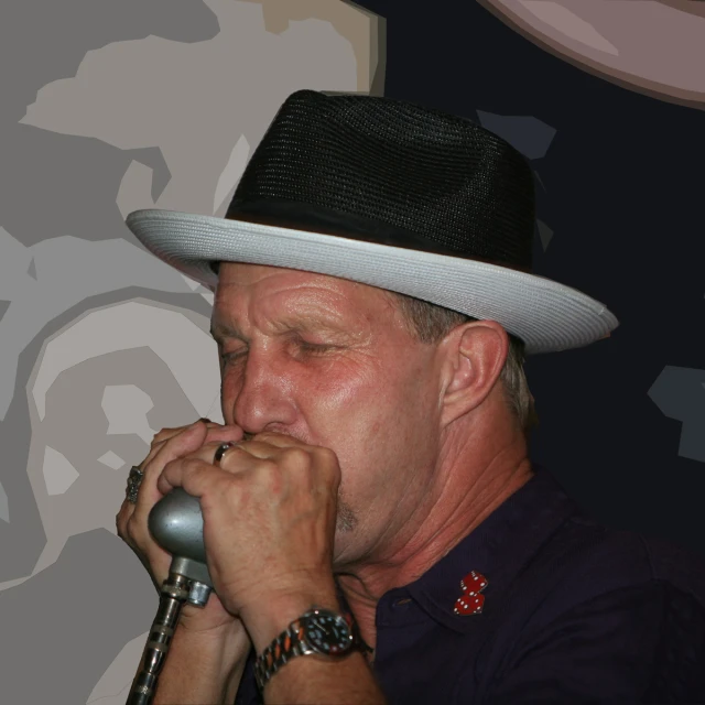 a man in a white hat singing into a microphone