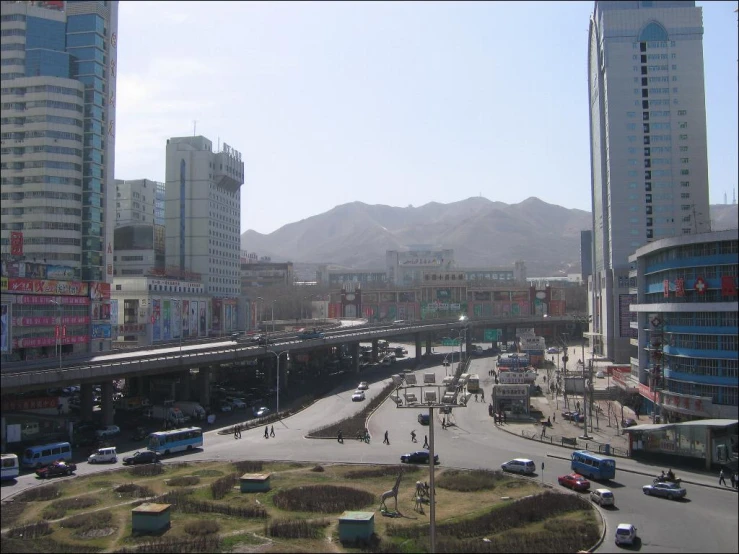 traffic is parked on the busy road in an open city