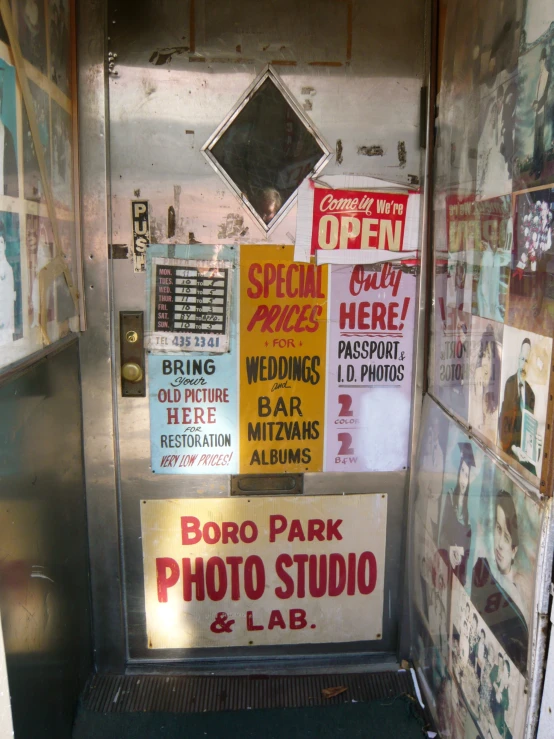 a doorway with signs posted all around it