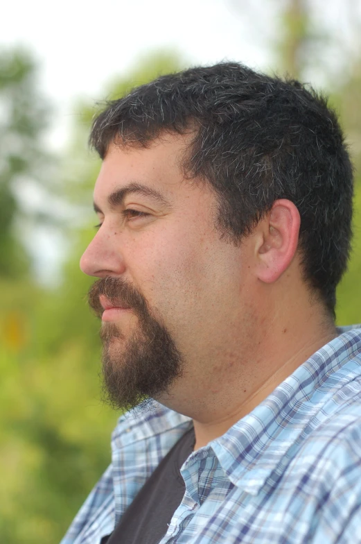 a close up s of a man with short dark hair