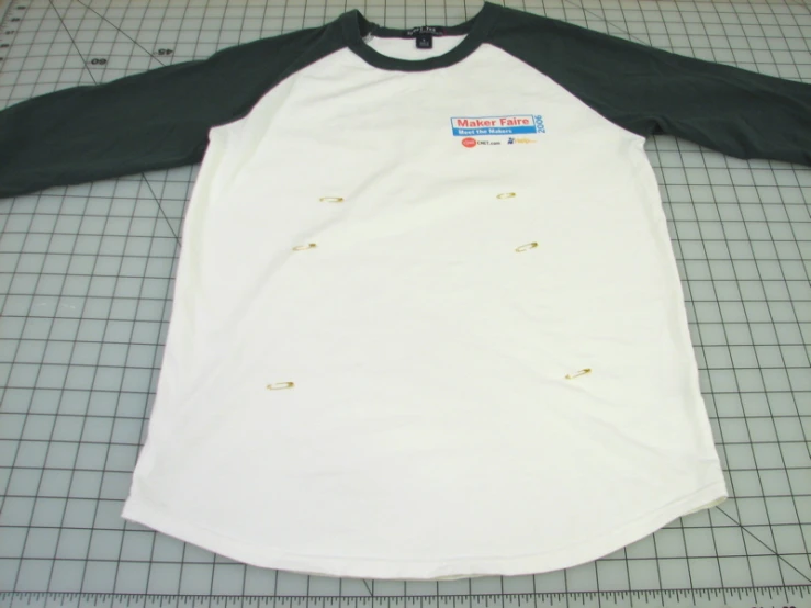 a shirt is shown with ons on it