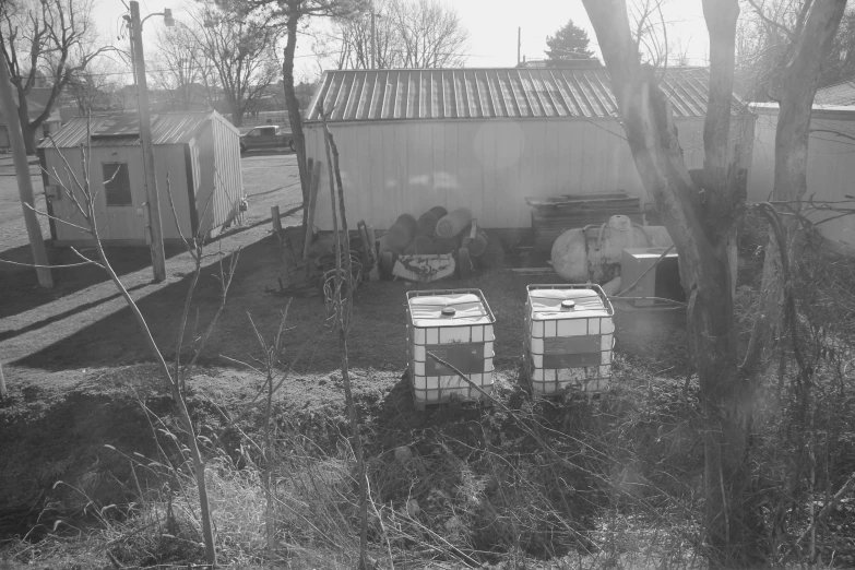 an old po shows two coolers and a shed