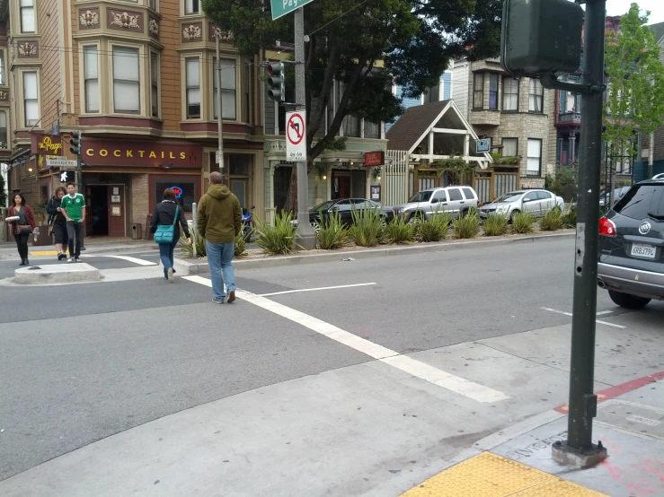 the crosswalk is busy with people crossing