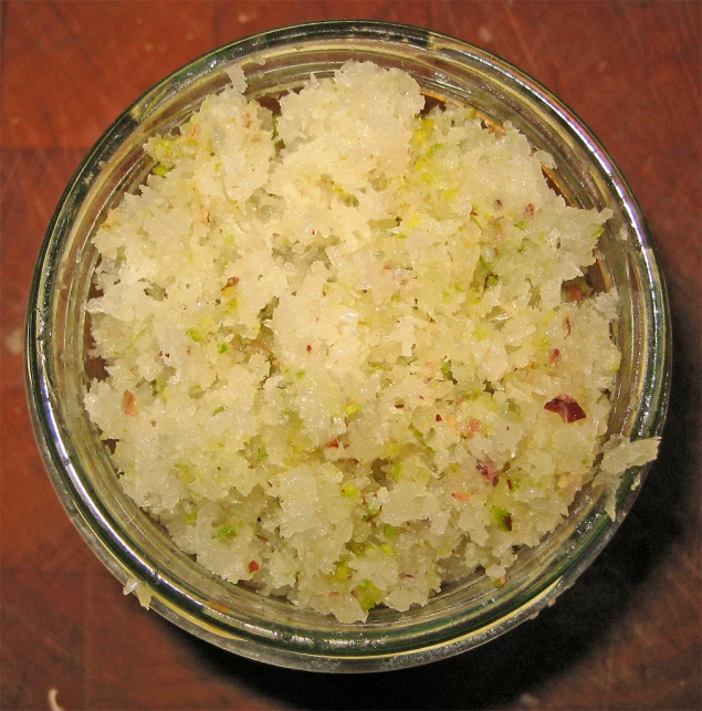 the bowl is full of rice and has vegetables