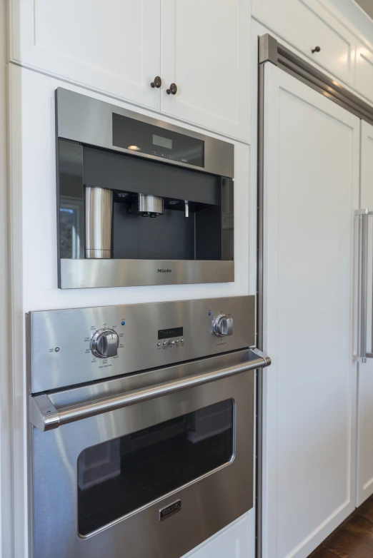 the kitchen is equipped with stainless steel appliances