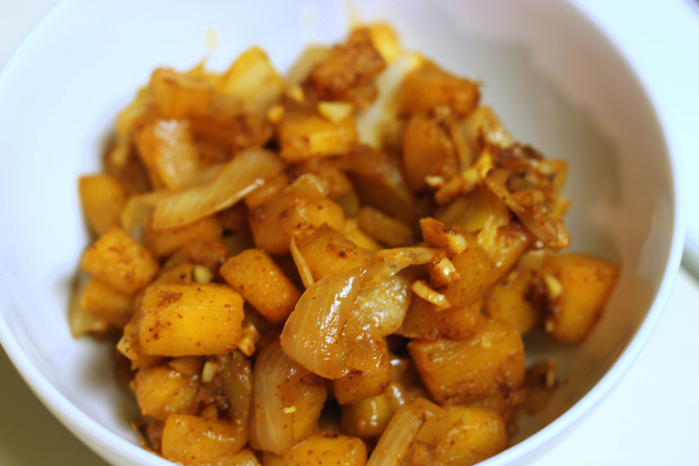 a bowl full of food with brown liquid