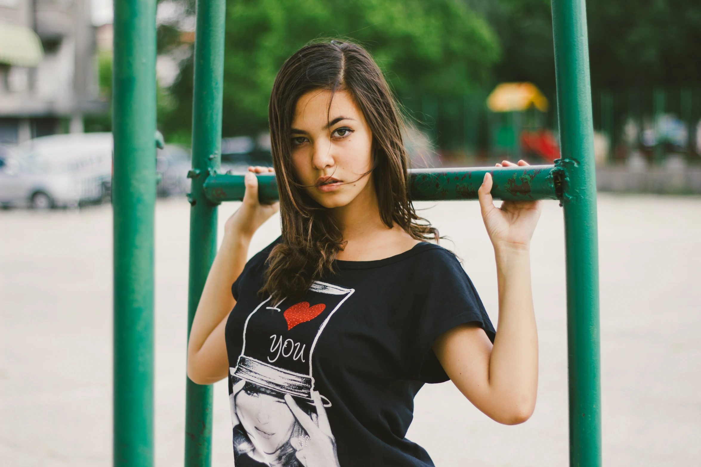 an image of a beautiful woman posing at a playground