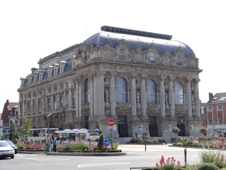 a large old building with clock faces on the top