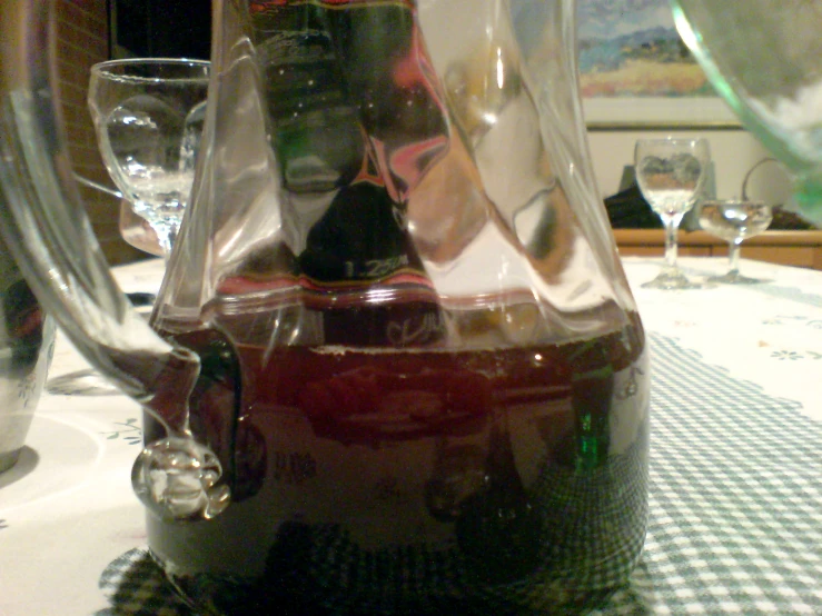 wine being poured into an interesting pitcher shaped container