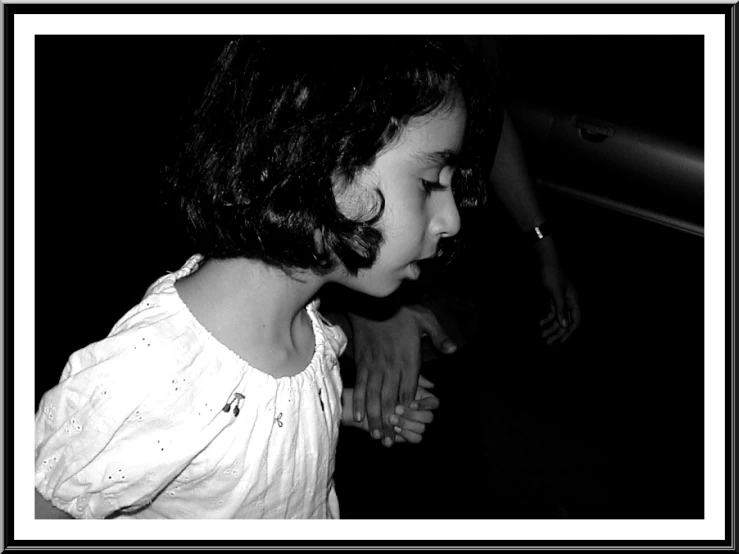 black and white po of a child looking down