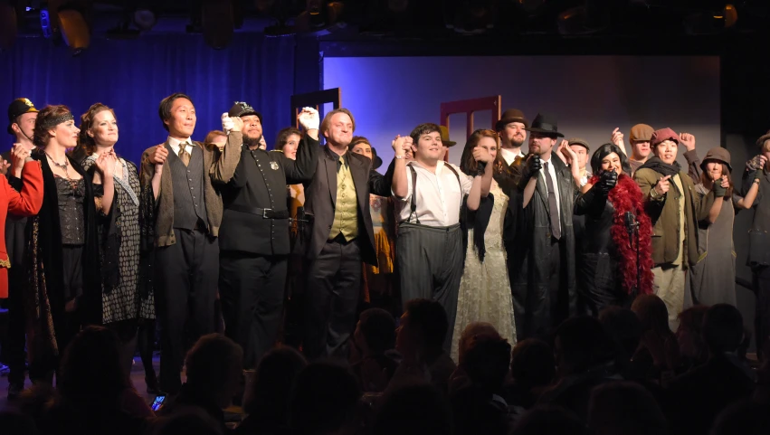 a group of people standing on top of a stage