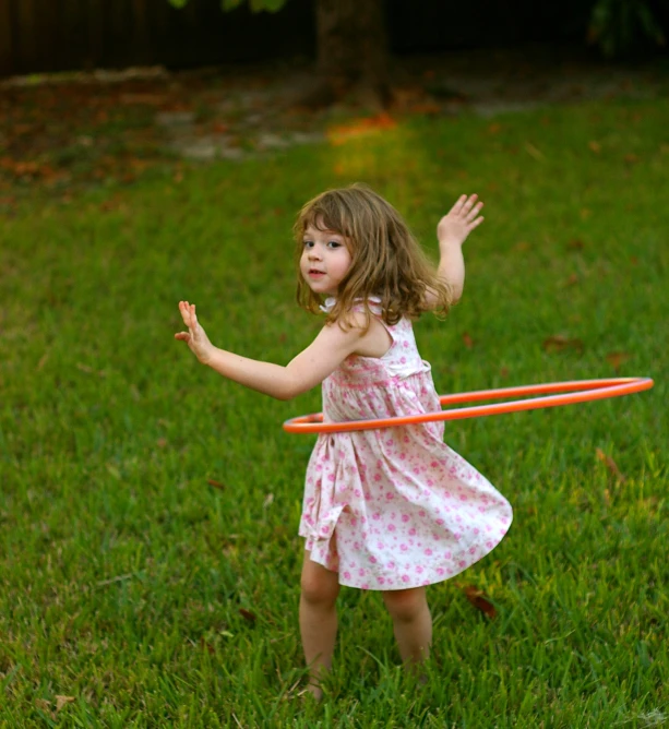 a  is playing with a frisbee in the grass