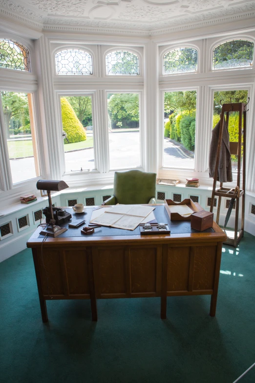 an office with multiple windows and lots of equipment