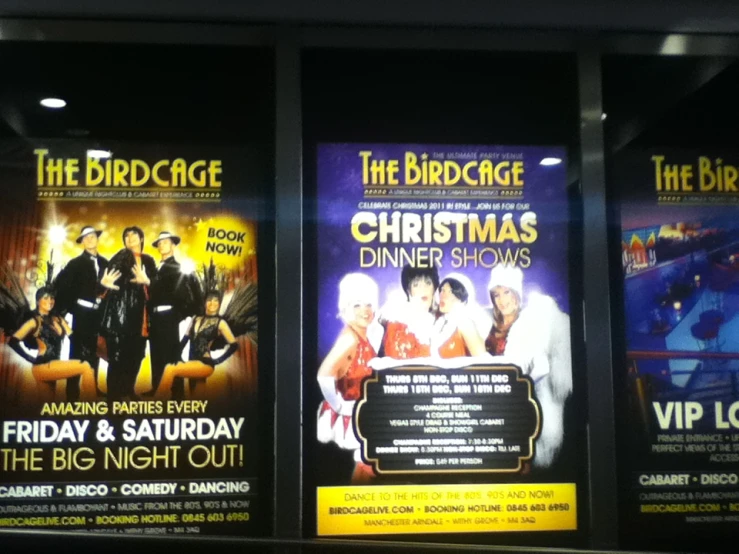 three large posters advertise an upcoming holiday show