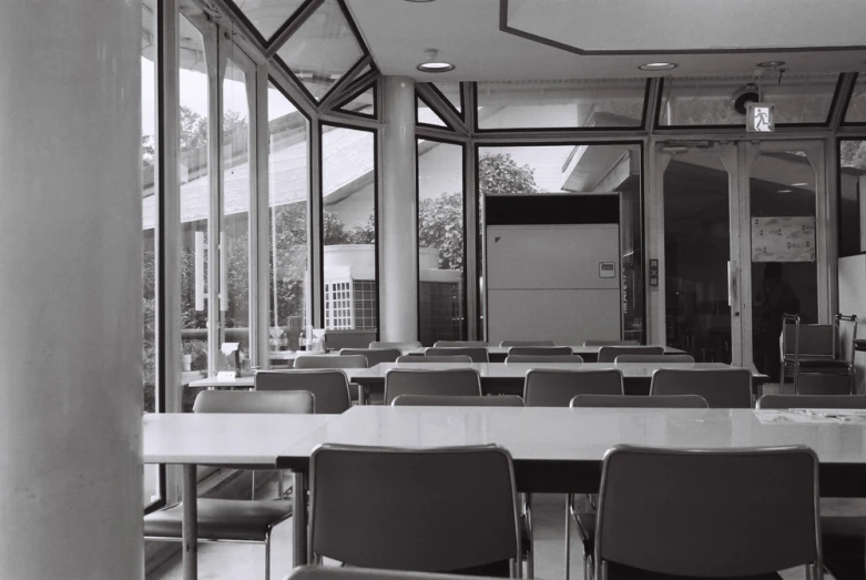 black and white po of a classroom with tables and chairs