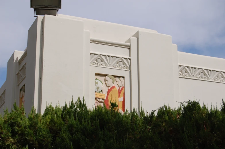 a large building with a decorative mural on the side