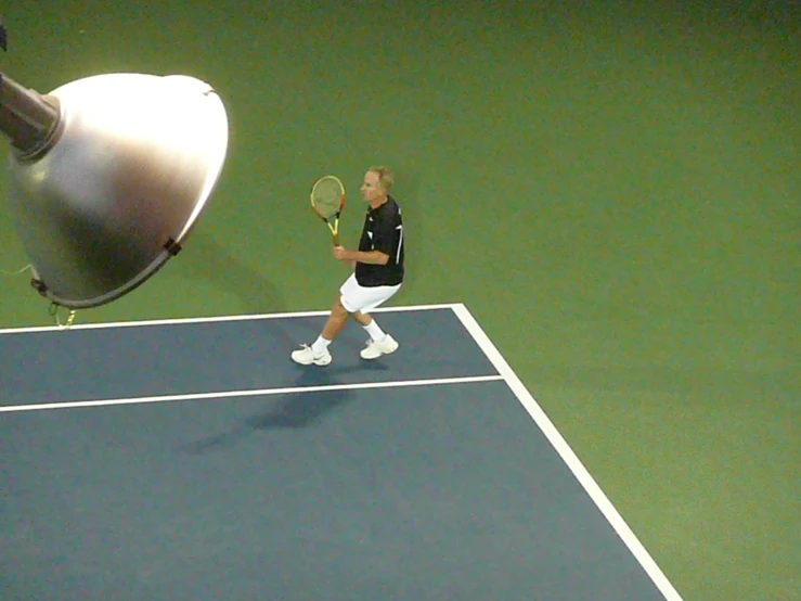 a female tennis player is running with a racket