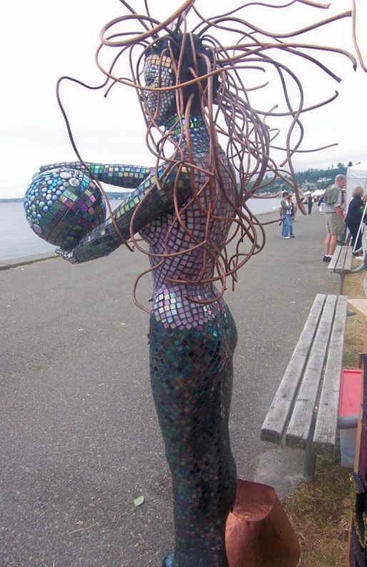 a statue with multiple wires attached to the body