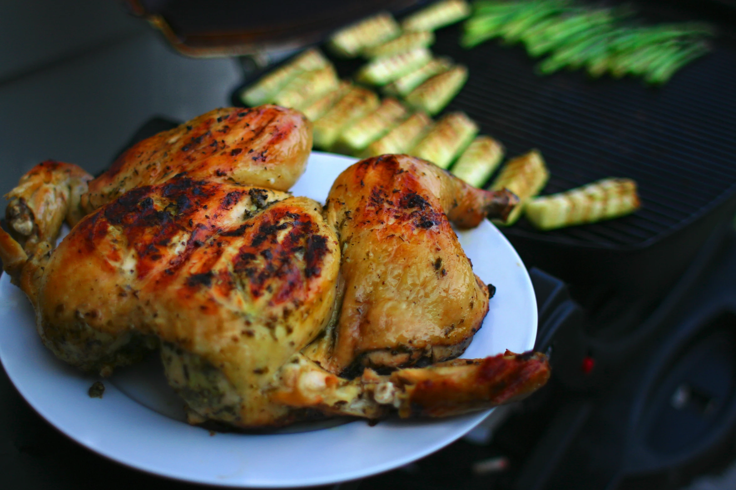 grilled meat and some vegetables on a grill