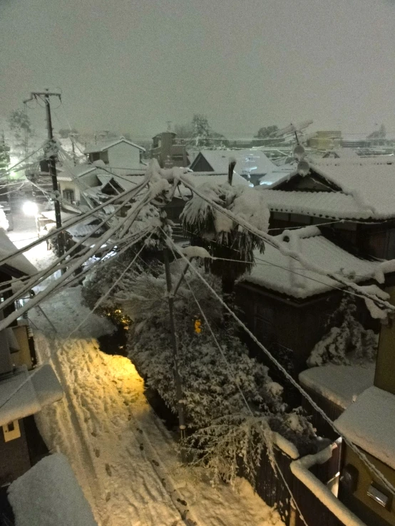 a train traveling down tracks covered in snow