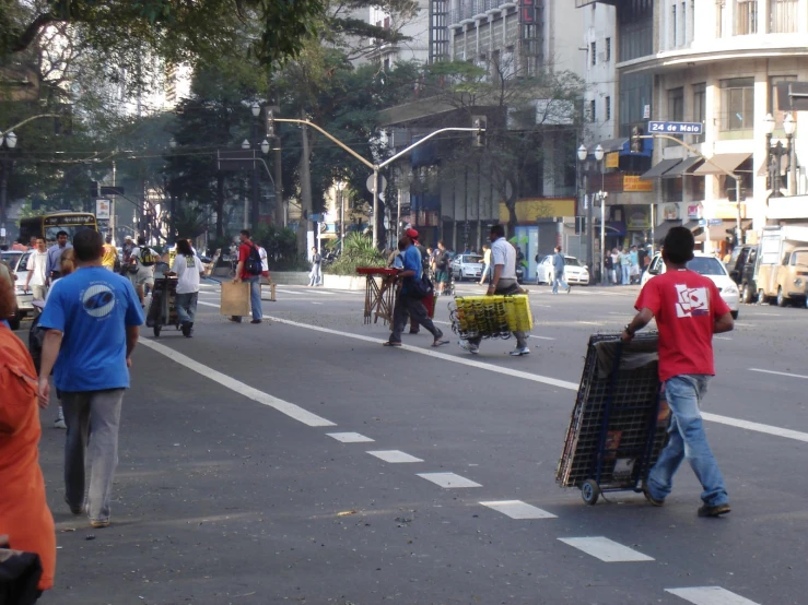 people are walking on a busy city street