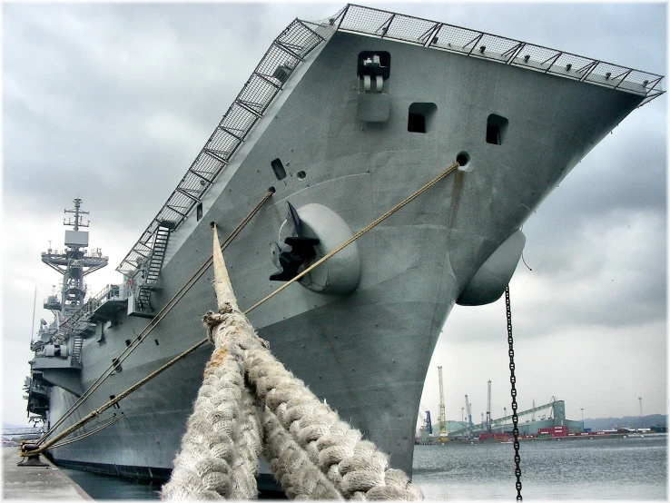 the large battleship is moored up to be used for a boat