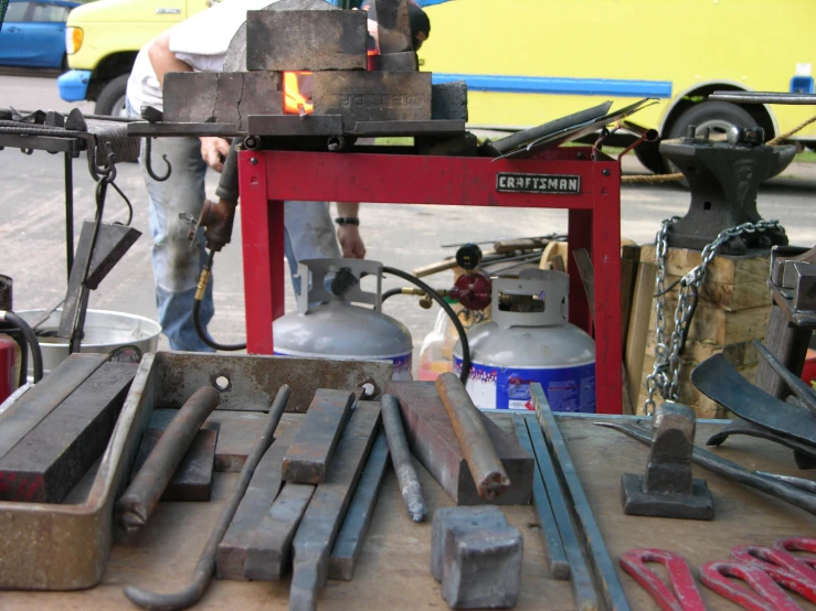 an assortment of tools are being worked on by a man