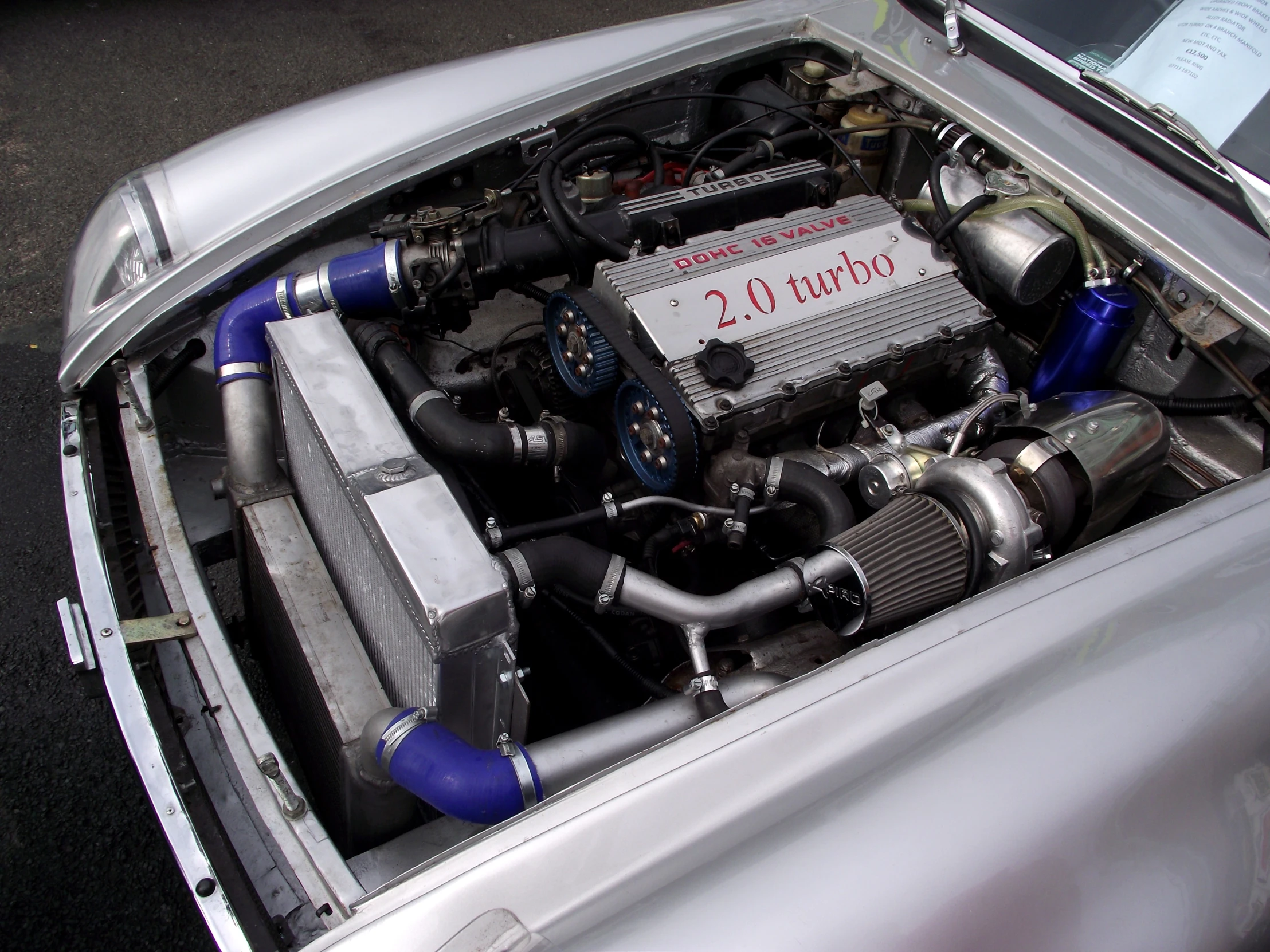 a car engine with two turbo inlets on the top