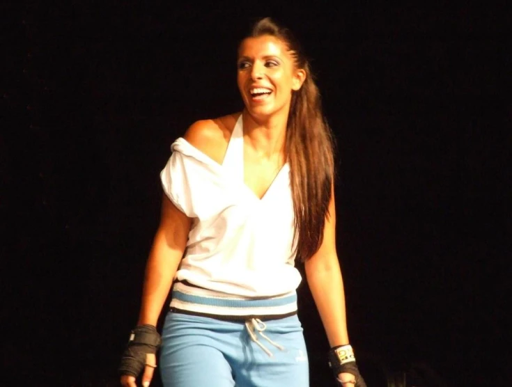 an image of a woman laughing on stage