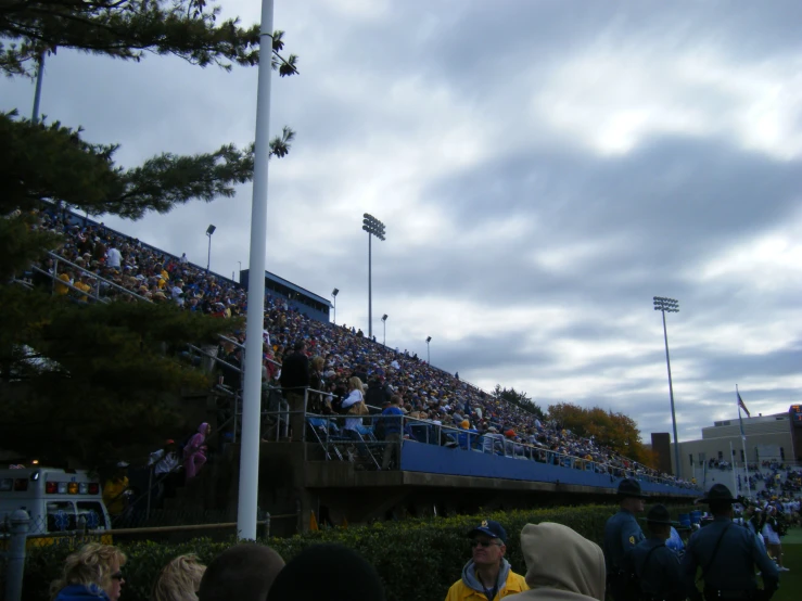 some people are standing on an area at a baseball stadium