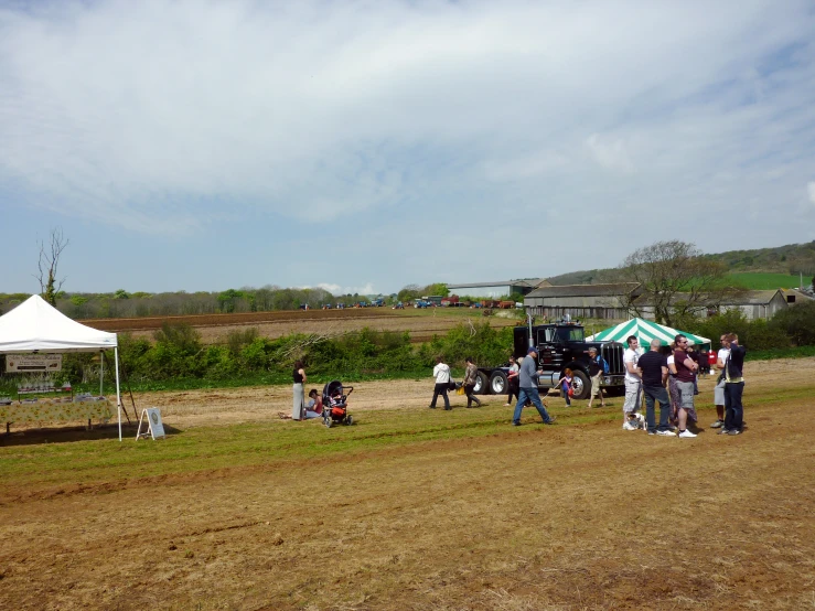 a couple of people standing on top of a field