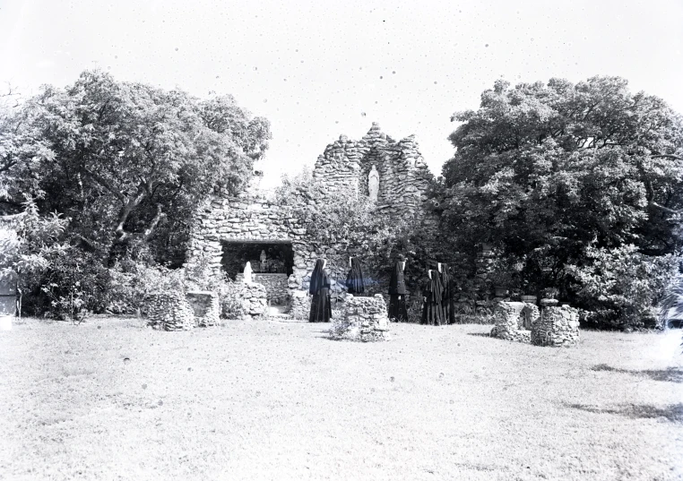 an old po of a small cabin by trees