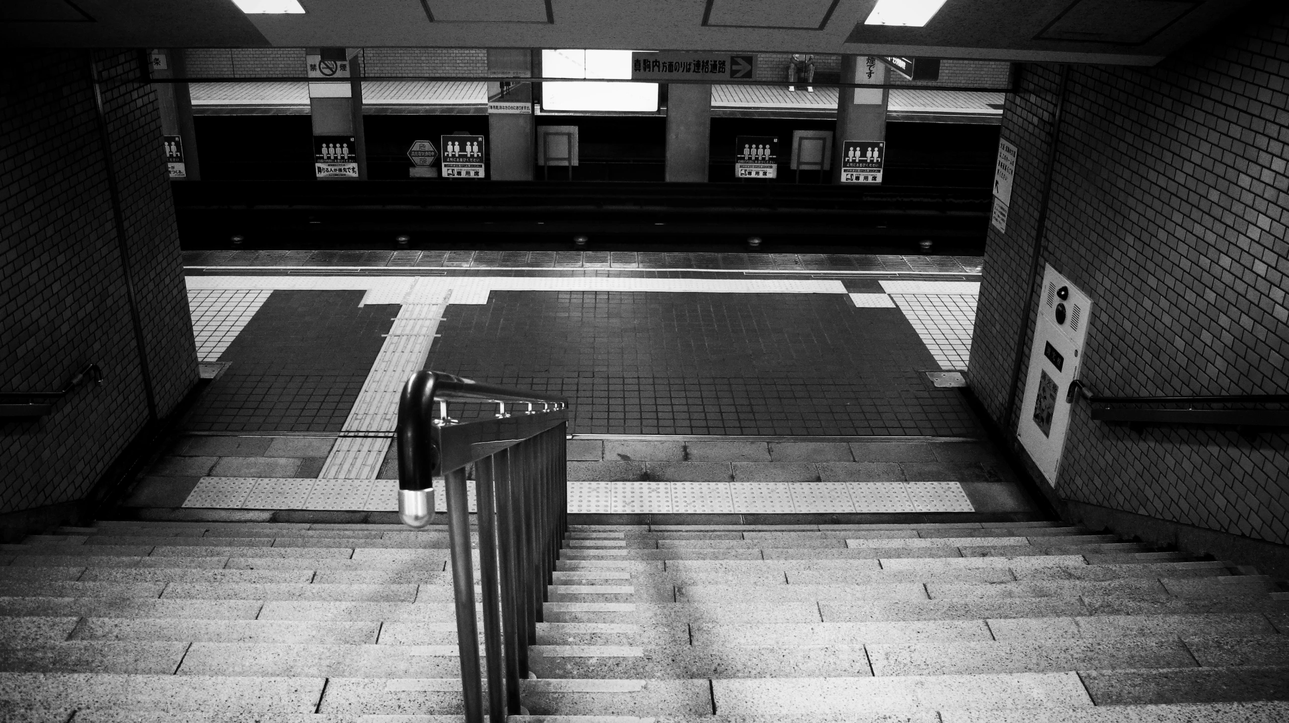 a public walkway in a subway with only steps and rails