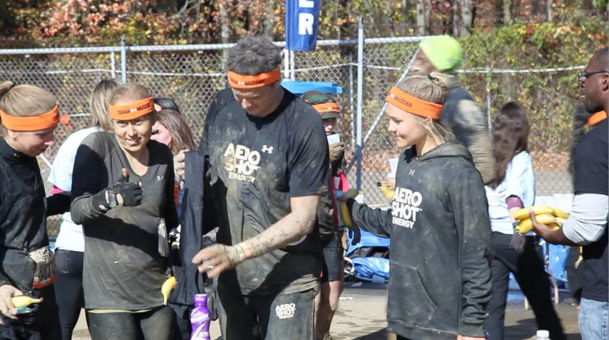 a group of people wearing mud and bandanas