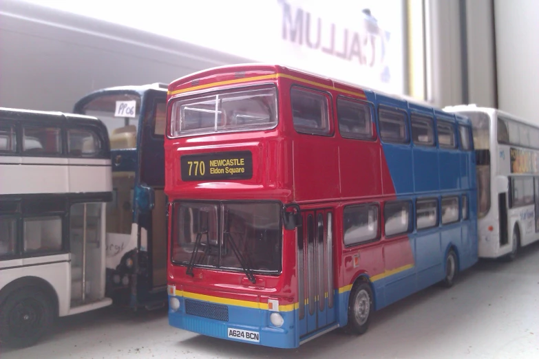 two double decker buses parked next to each other