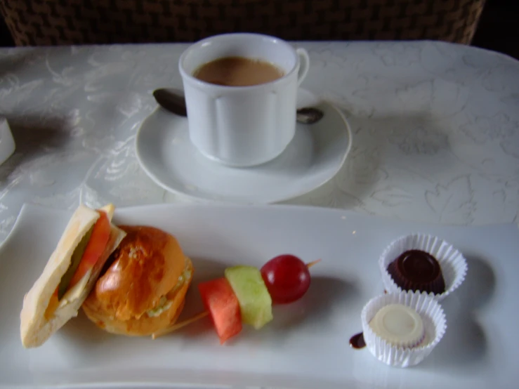 a plate with food, a cup and a saucer