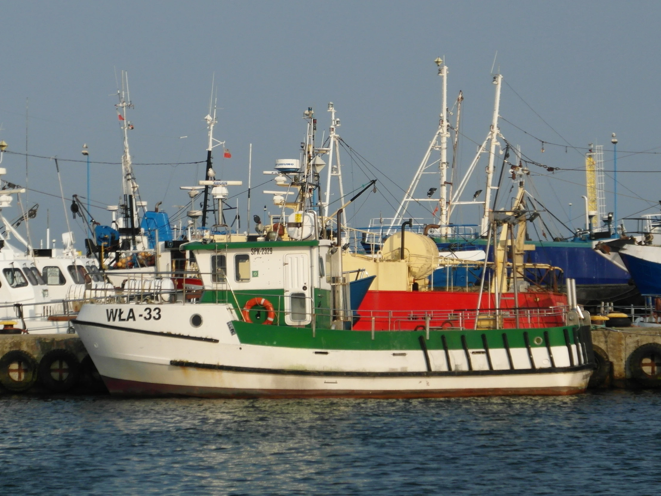 a boat is docked in the water at a pier