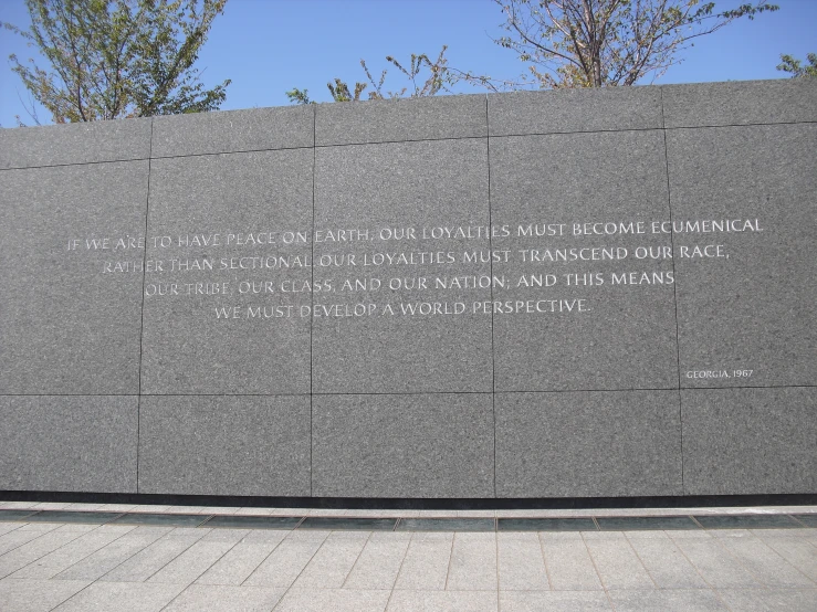 a memorial area with stone memorial plaques and words