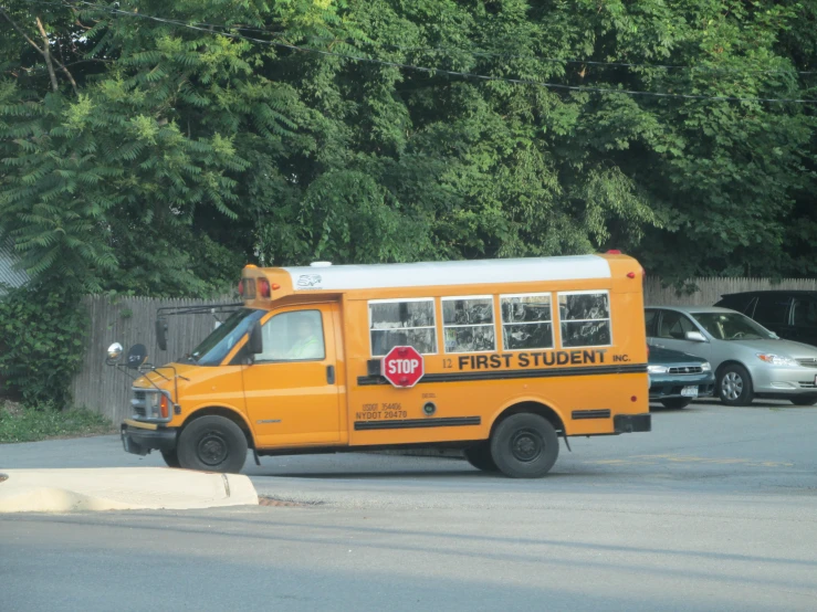 a yellow school bus with a red stop sign on the side of it