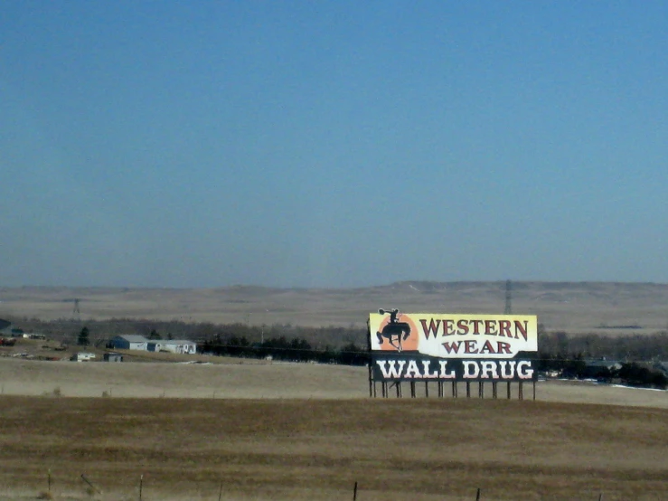 two billboards in an open empty, barren field