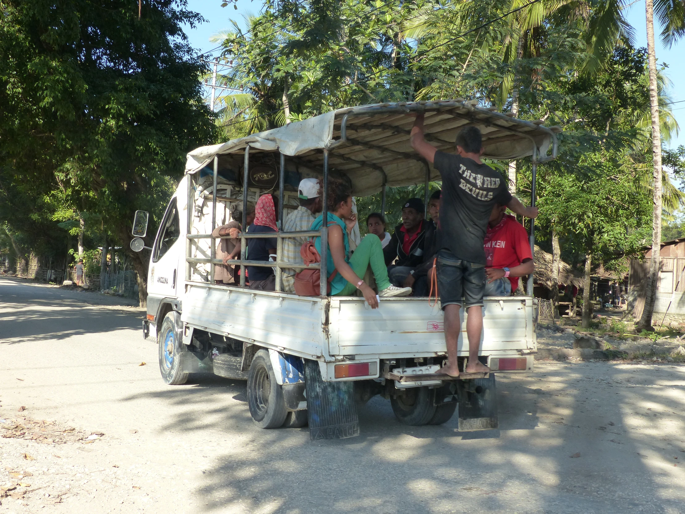 a group of people on the back of an open car