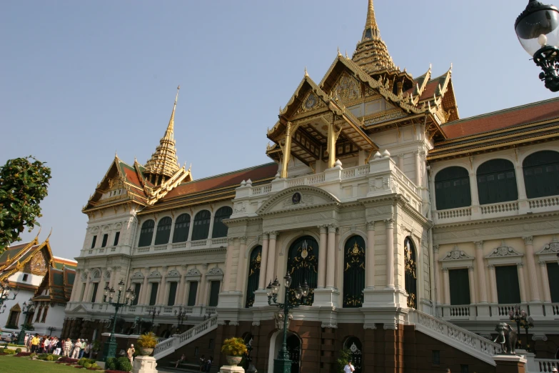 a very large ornate building with golden trim