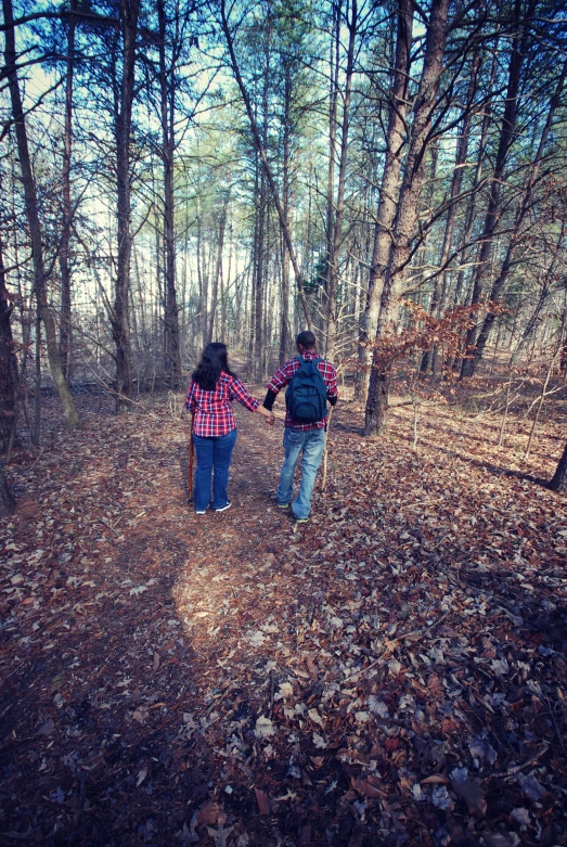 there are two people standing near each other holding hands