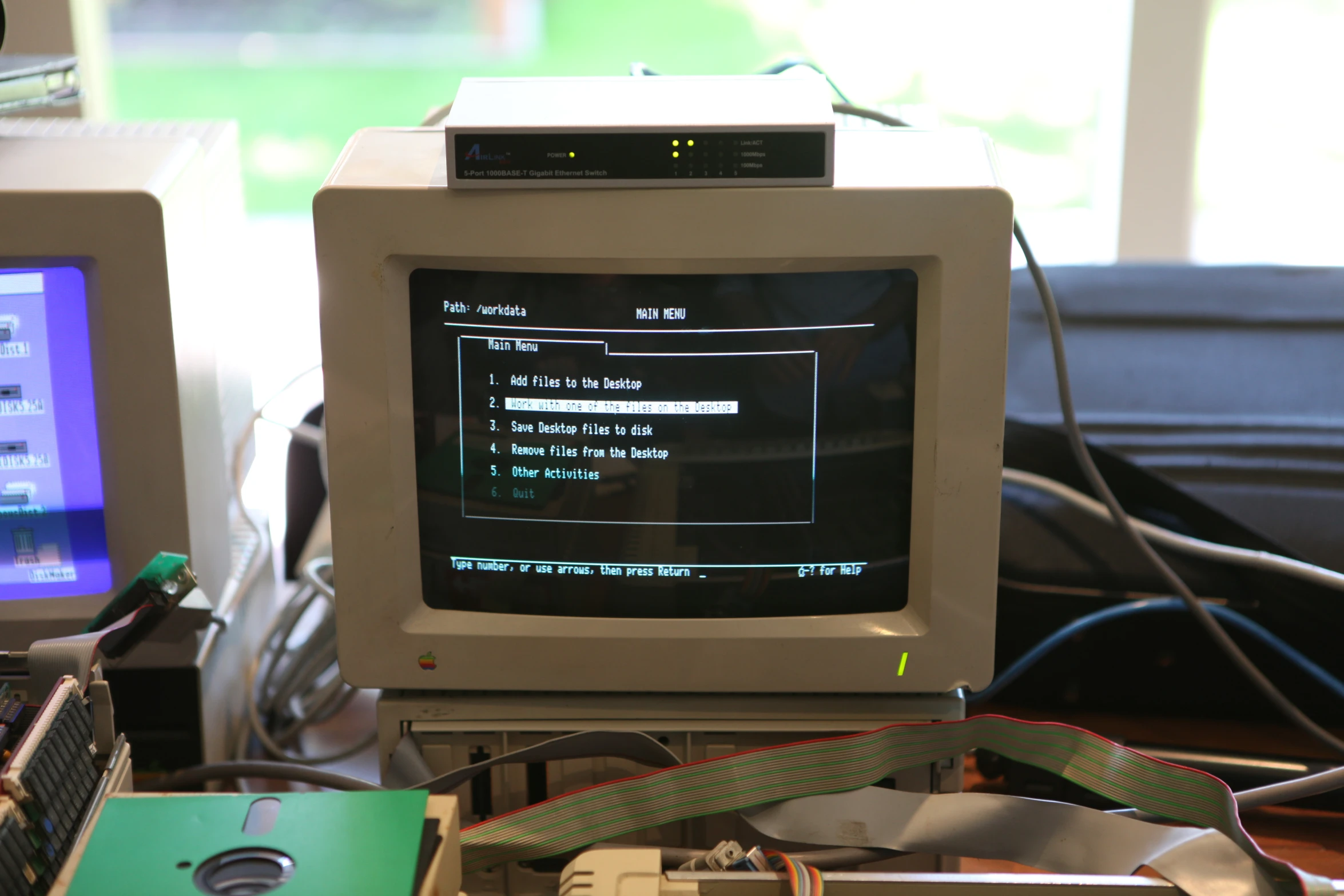 a small monitor sitting on top of a table