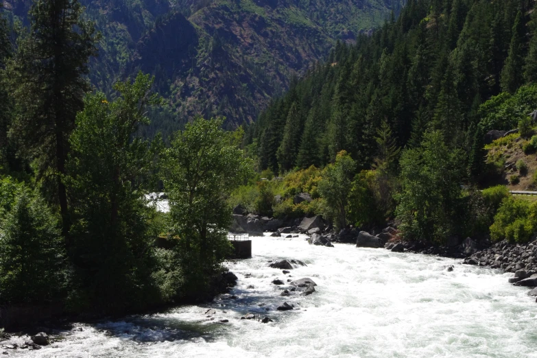 the view of some water running down a canyon