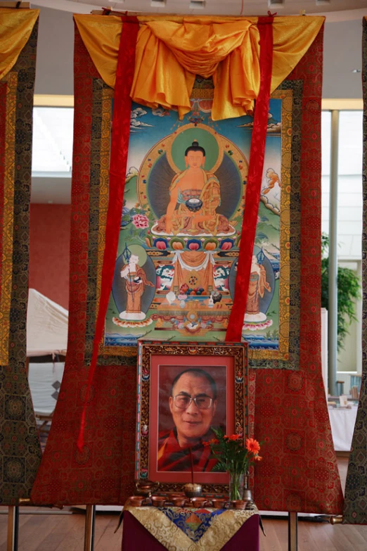 a pograph is hung up in front of a shrine